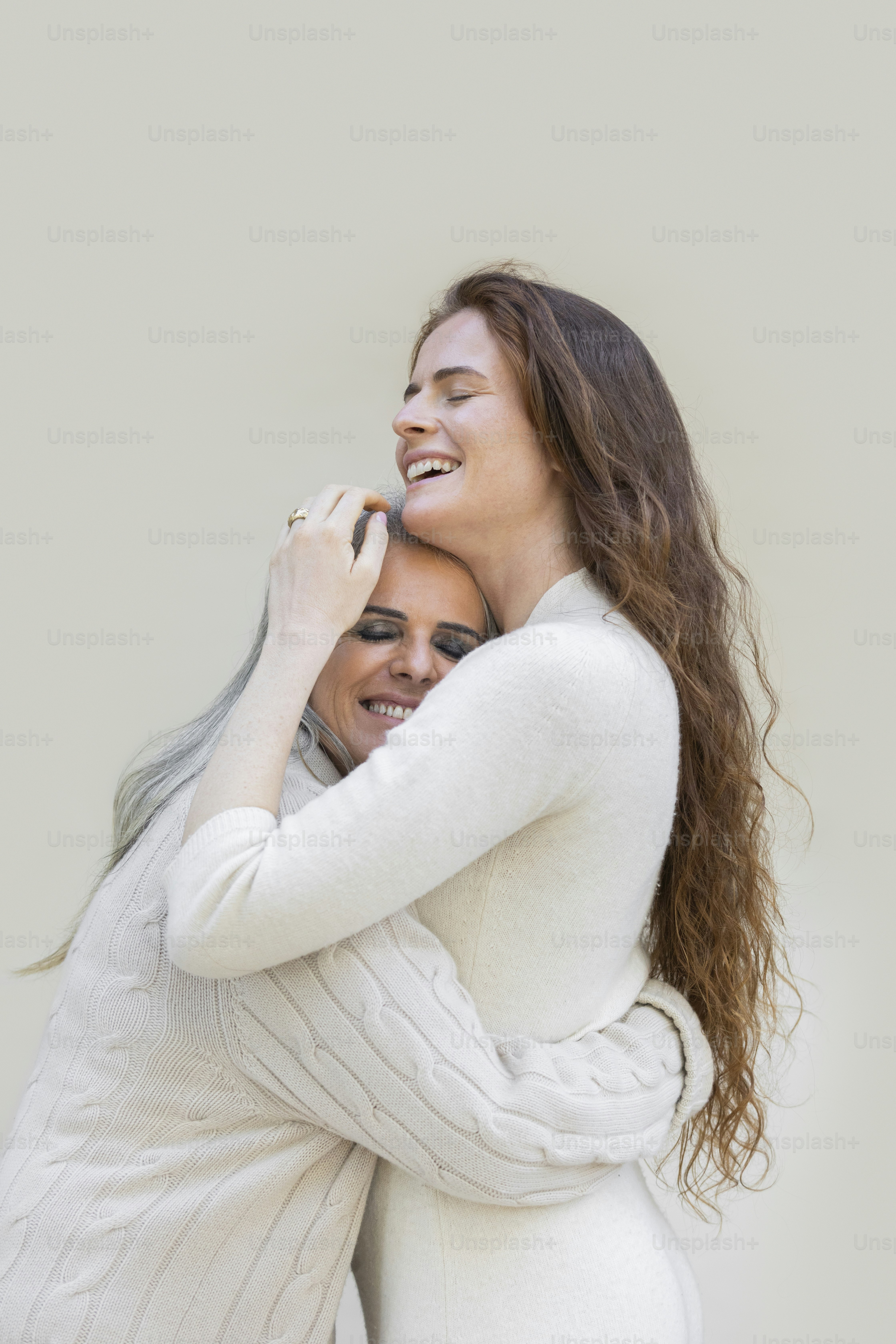 a woman holding a baby