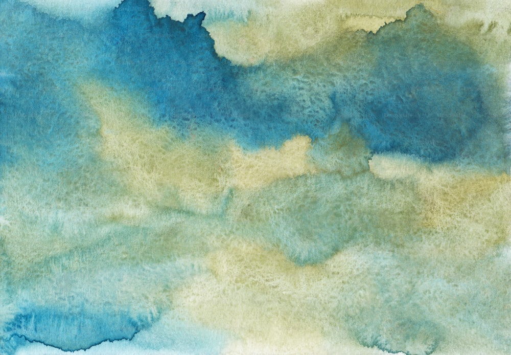 a watercolor painting of a blue and yellow cloud