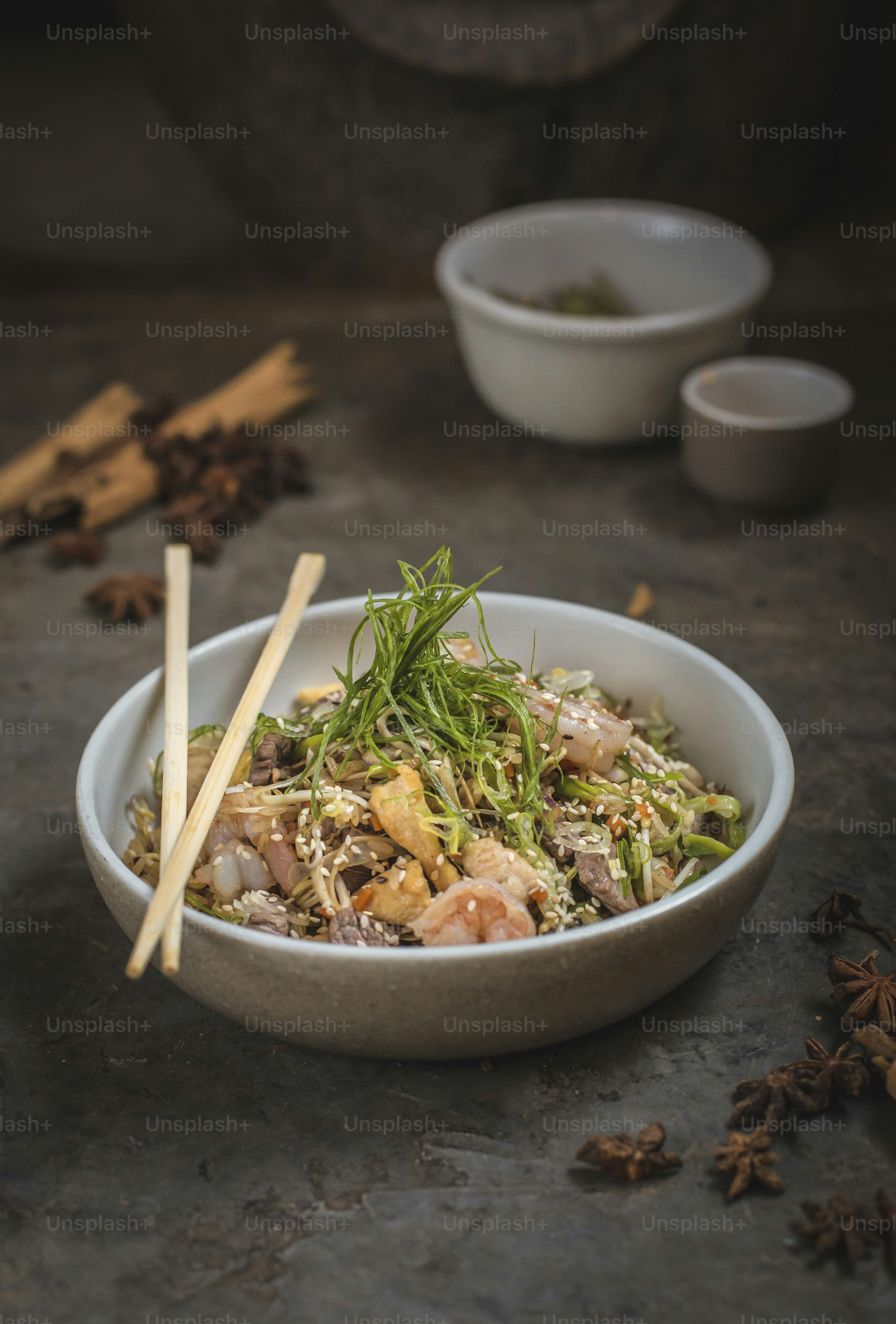 A bowl of food with chopsticks in it photo Food Image on Unsplash