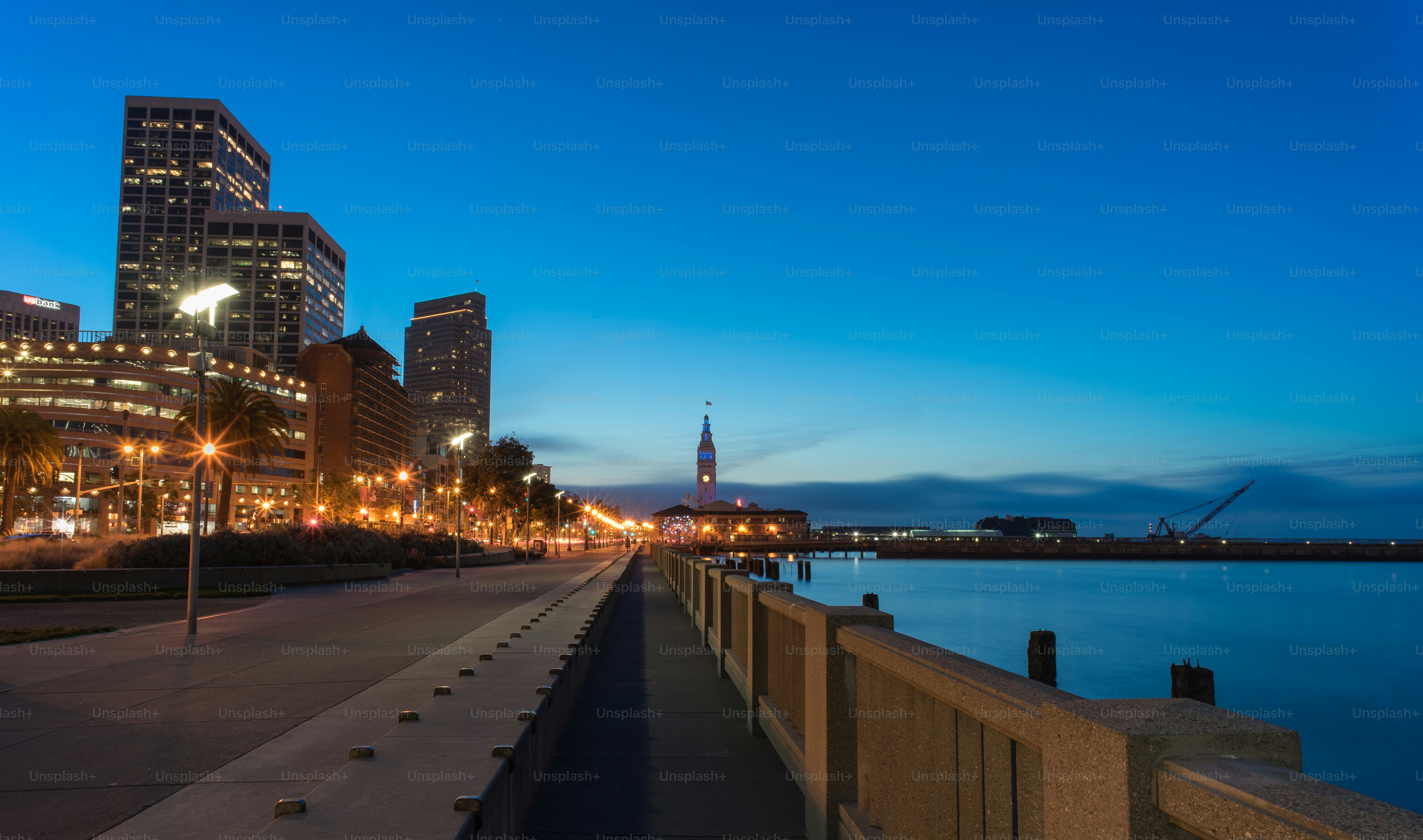 a view of a city at night from a pier
