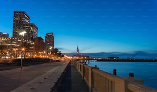 a view of a city at night from a pier