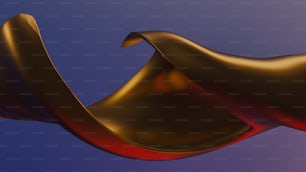 a close up of a red and gold object