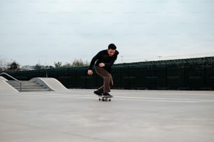 a man riding a skateboard down the side of a ramp