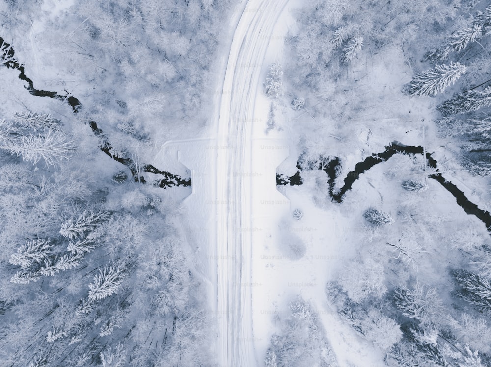 an aerial view of a snow covered road