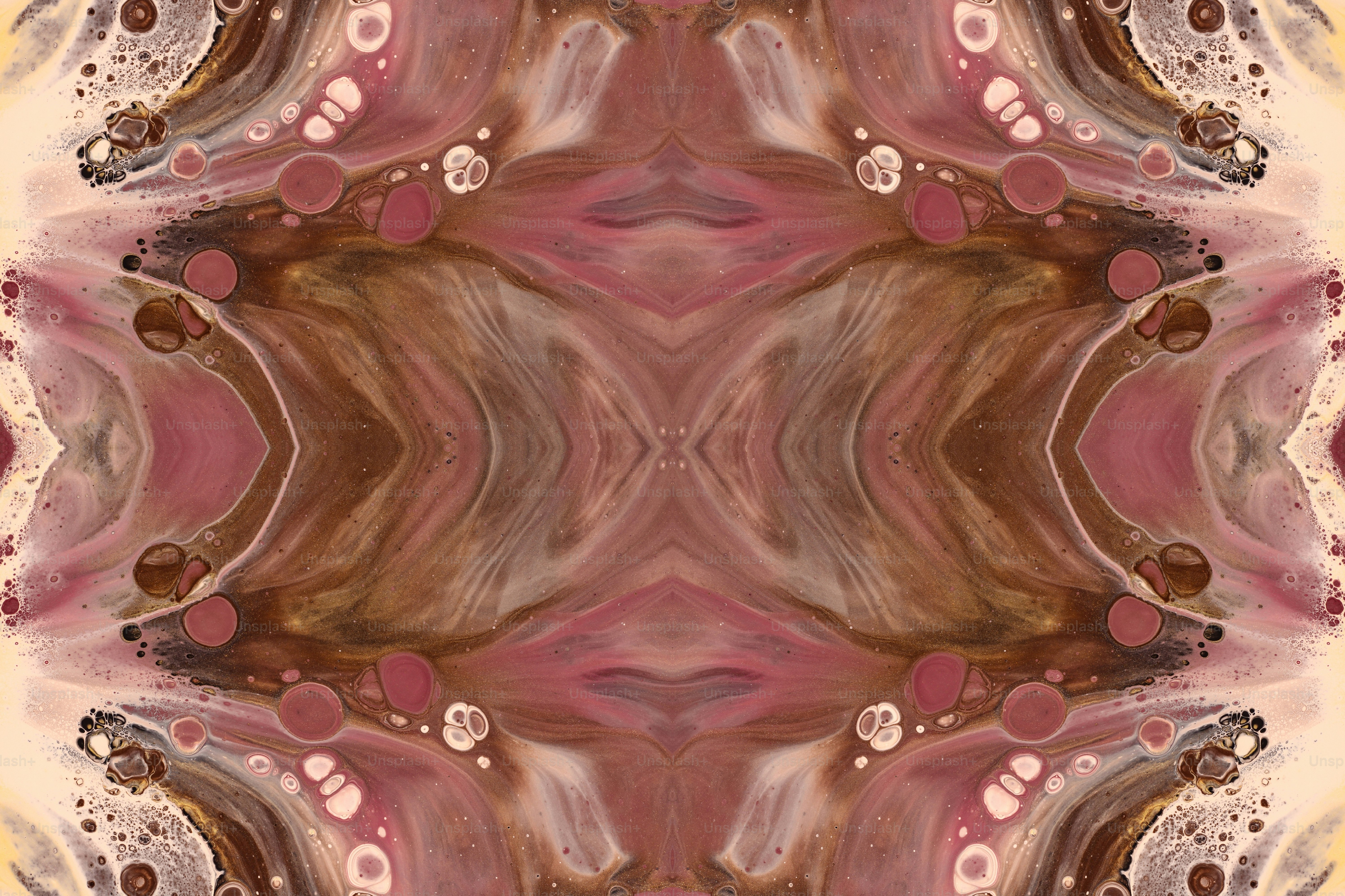 a picture of an abstract design in pink and brown