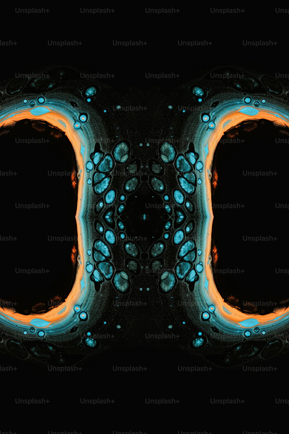 a black background with blue and orange circles