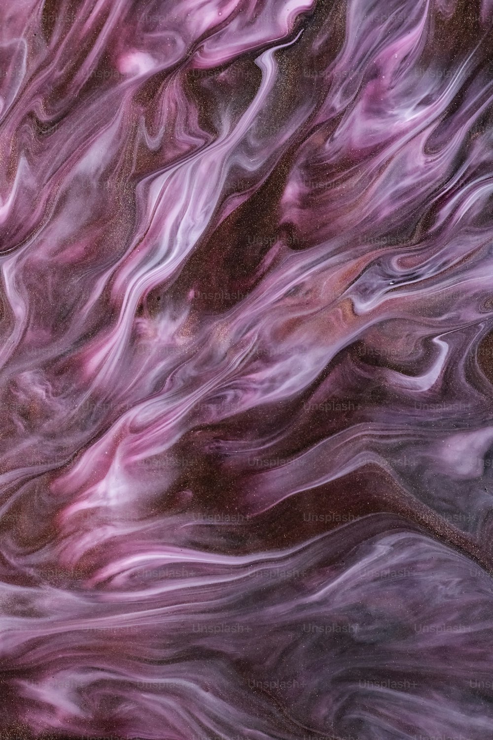 an abstract painting of purple and brown colors