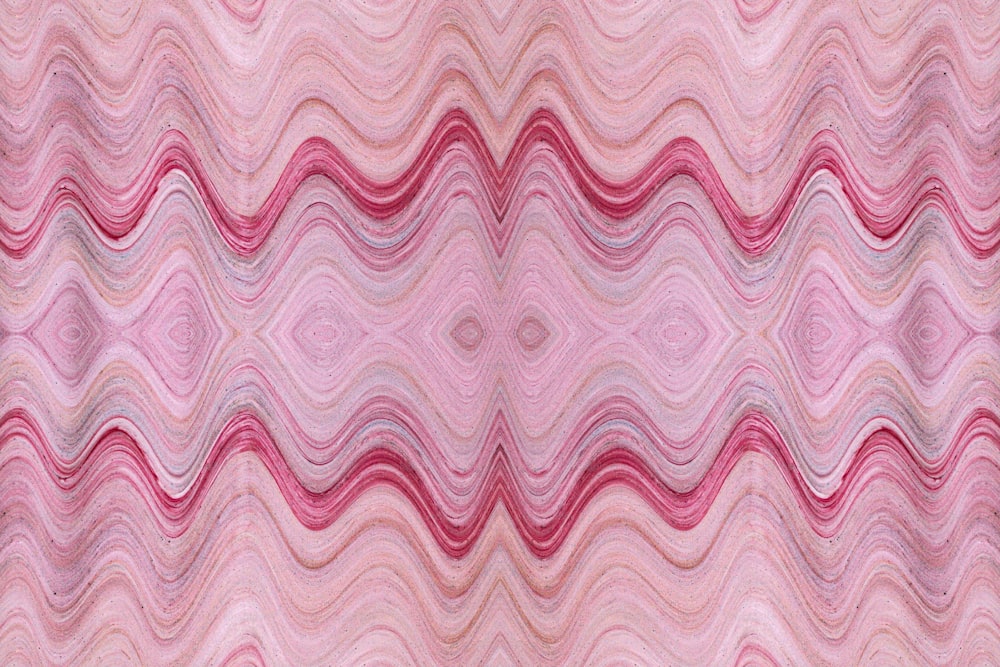 ein rosa und roter abstrakter Hintergrund mit wellenförmigen Linien