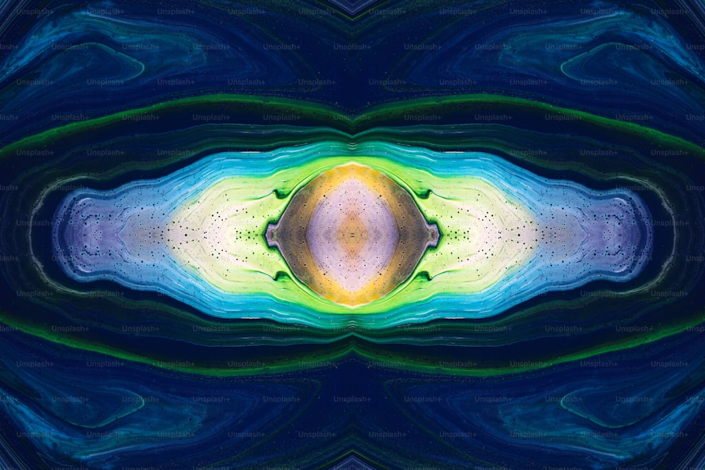 Una imagen abstracta de un objeto azul, amarillo y verde
