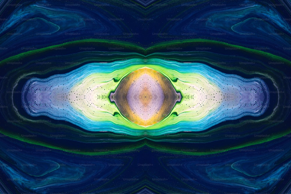 an abstract image of a blue, yellow and green object