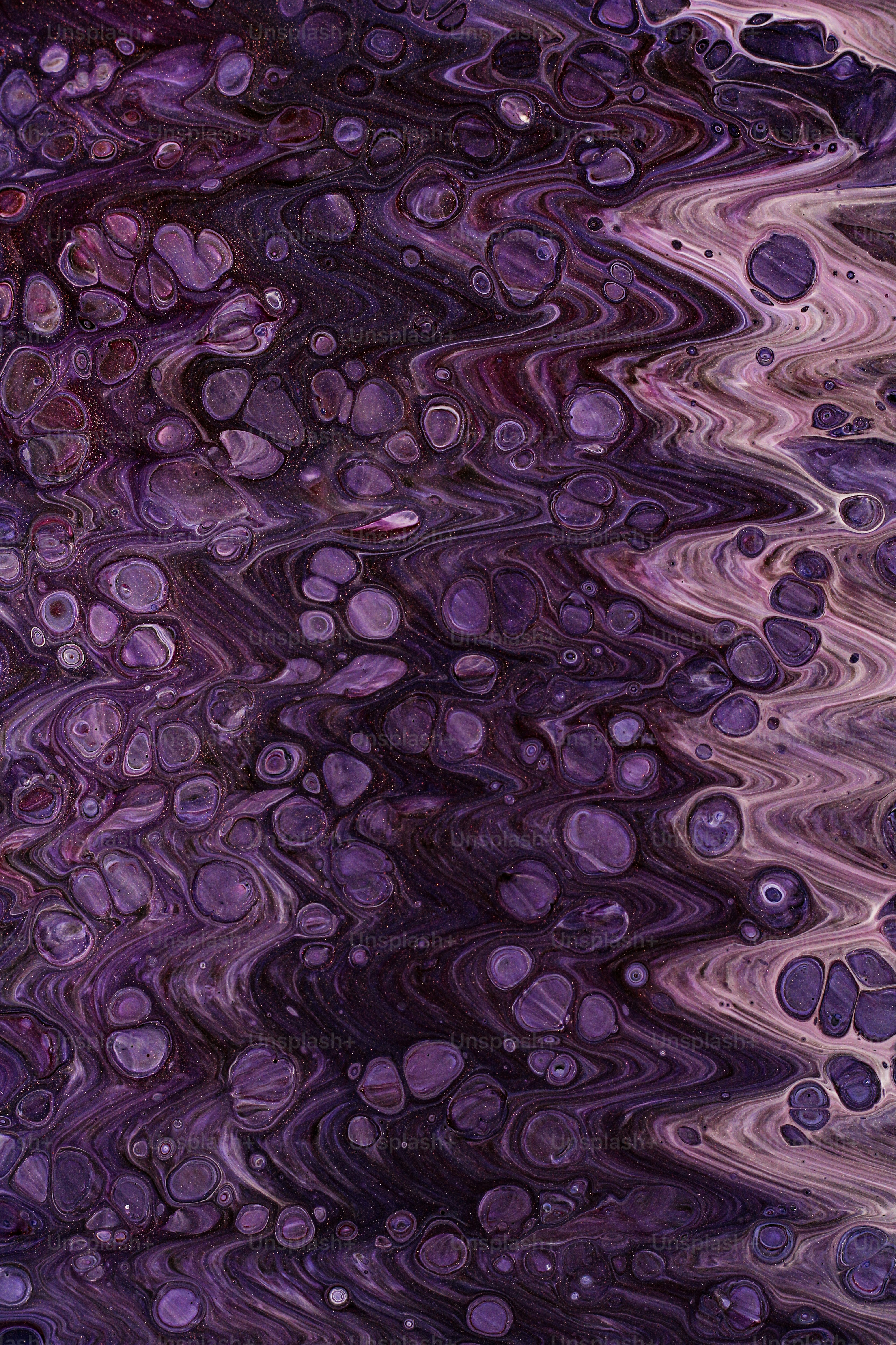 a close up of a purple and black surface