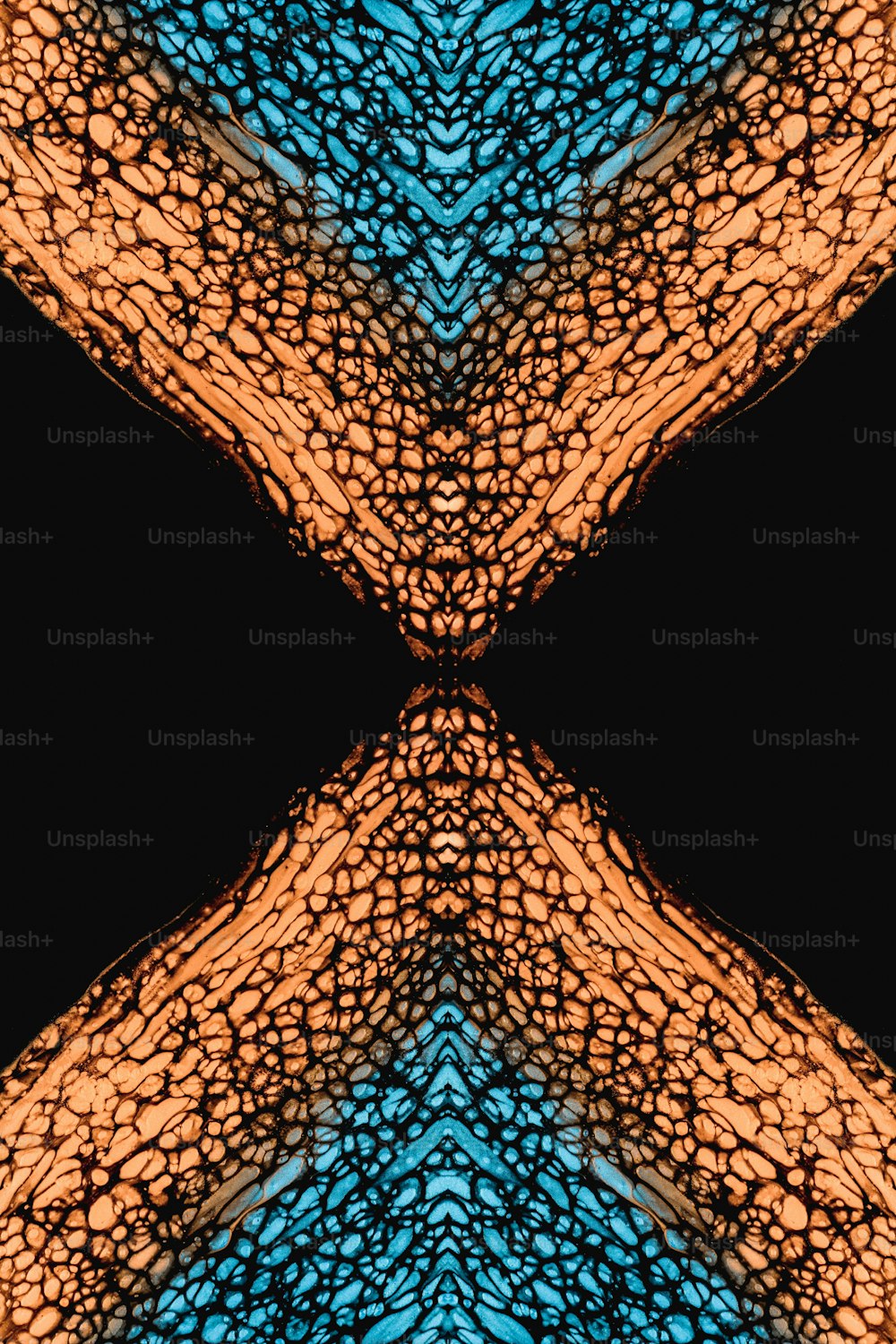 a blue and orange pattern with a black background