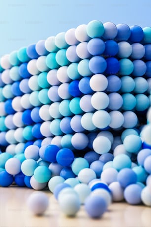 a pile of blue and white balloons on a table