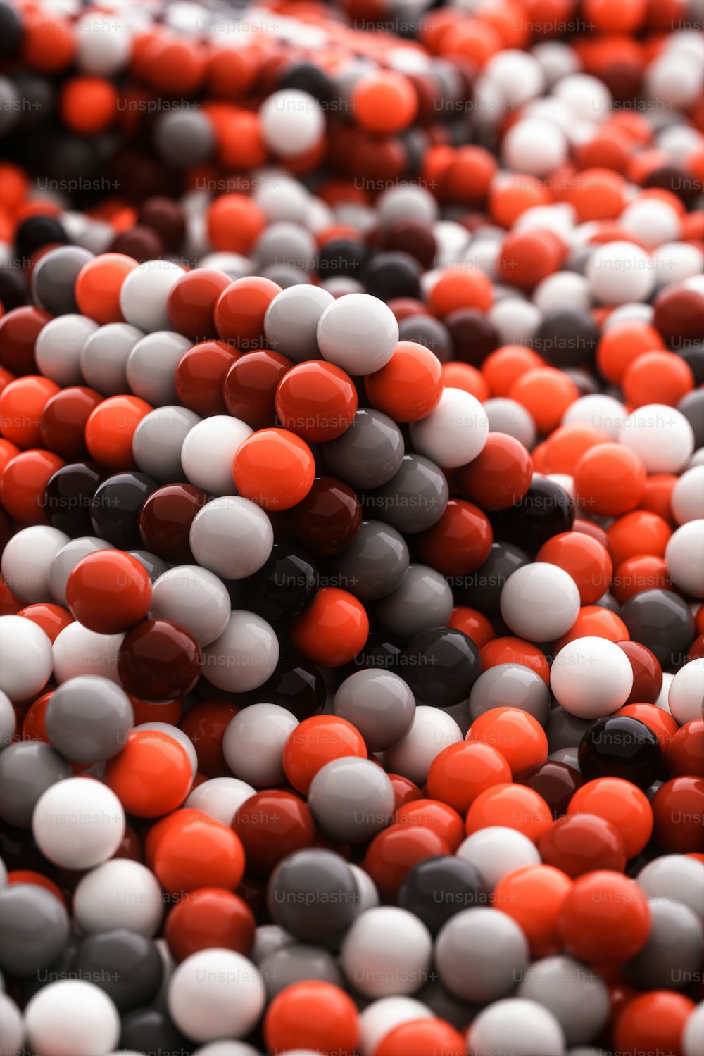 a pile of red, white and black candies