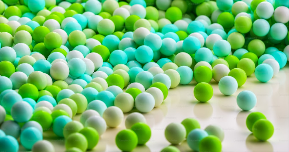 a bunch of green and white balls on a table