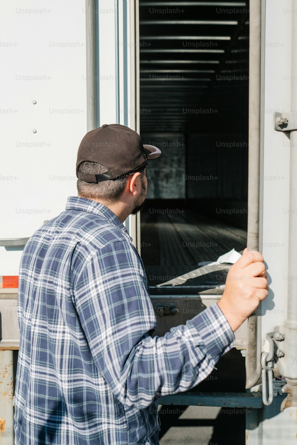 a man is opening the door of a truck