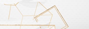 a white background with gold geometric shapes