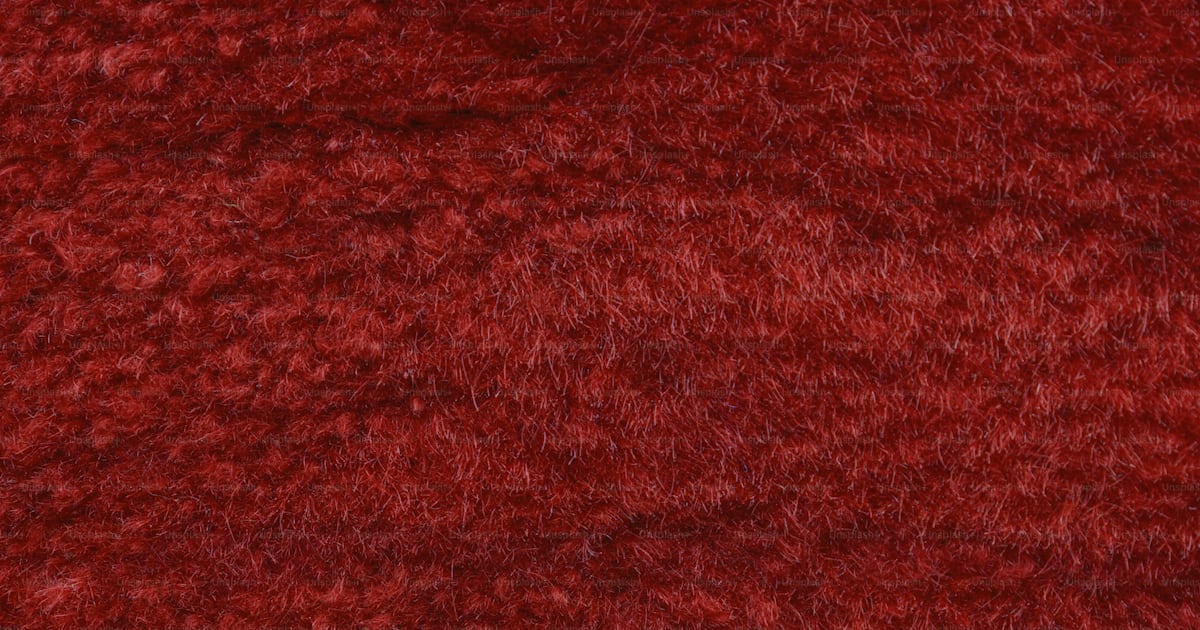A close up of a red area rug photo – Red Image on Unsplash