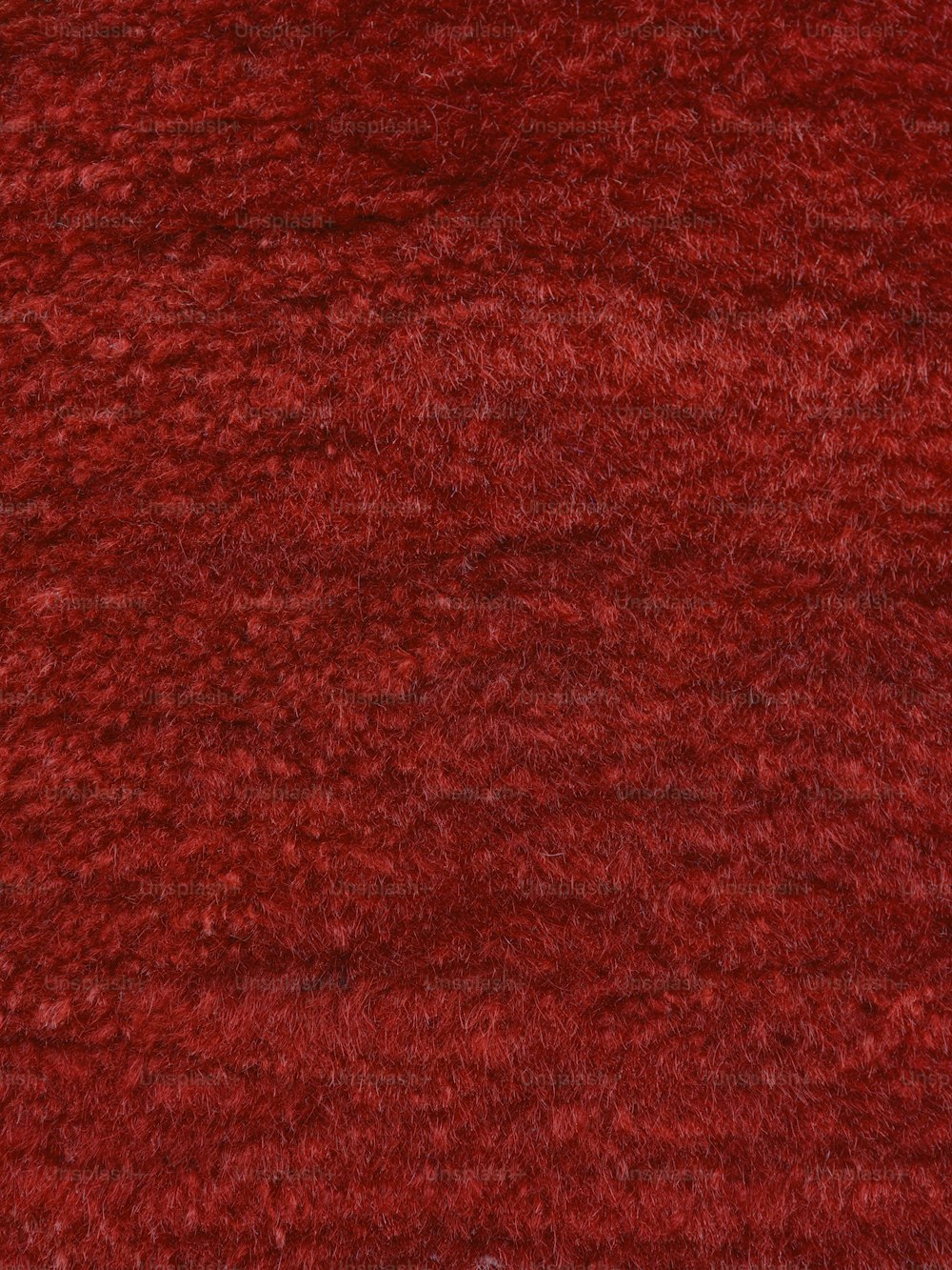 a close up of a red area rug