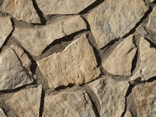 a close up of a wall made of rocks