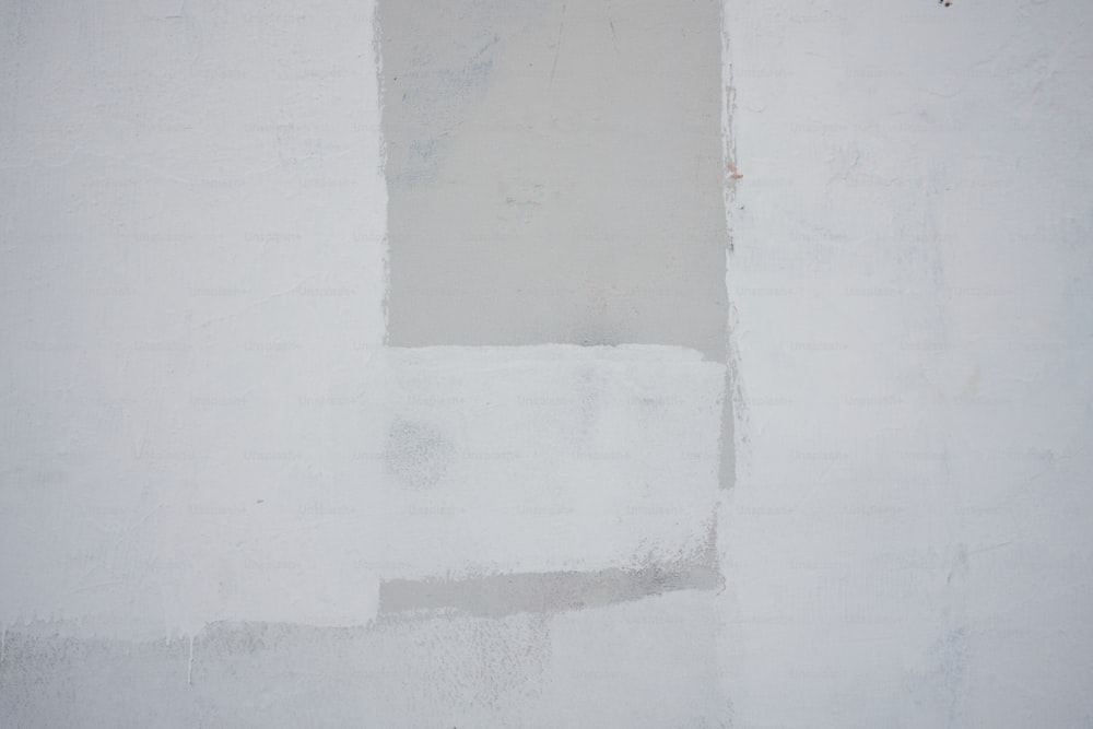 a white wall with a black and white clock on it