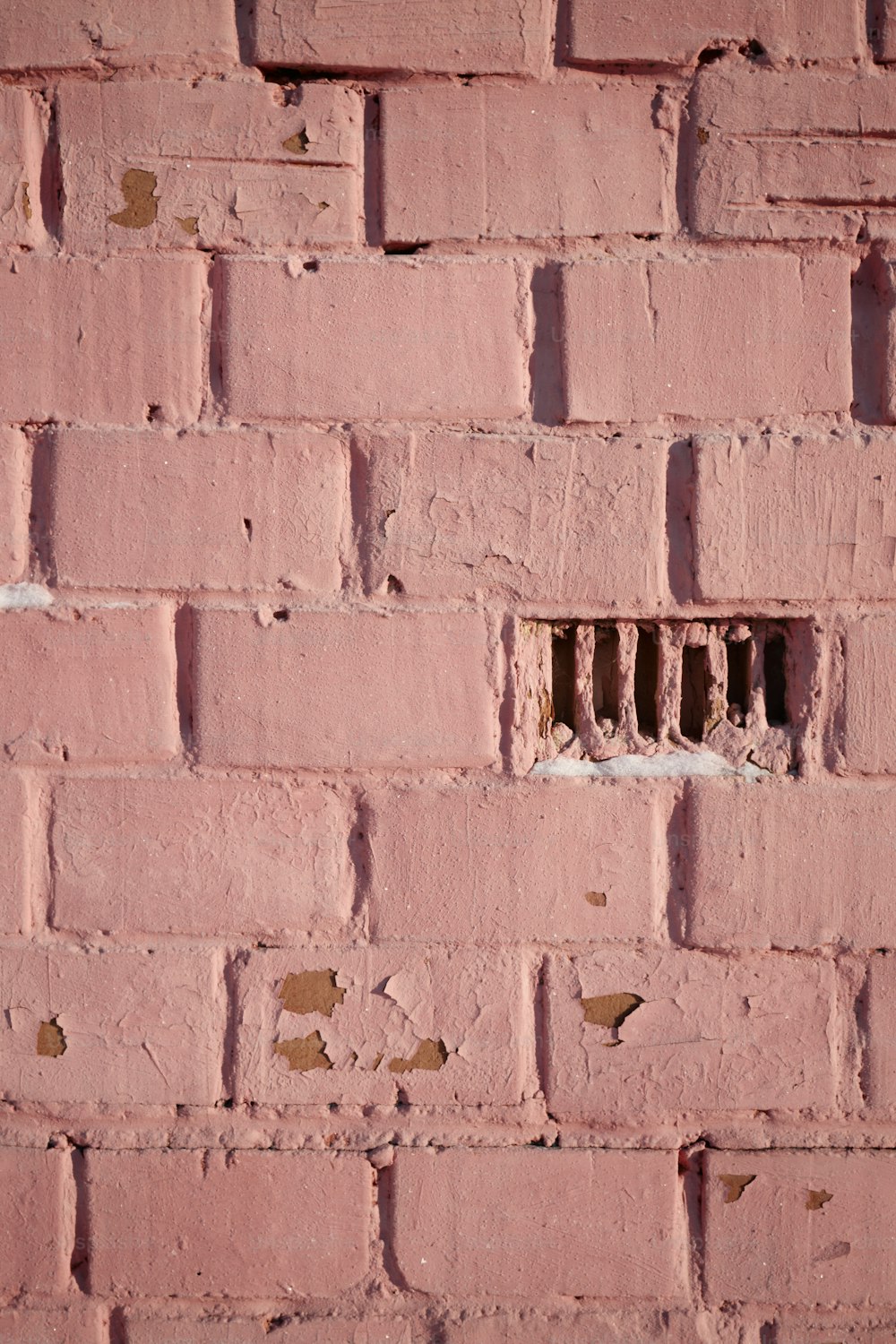 a brick wall with a hole in it