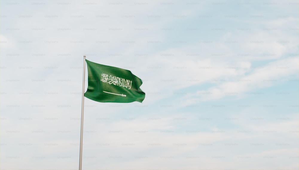 a green flag flying in the wind on a cloudy day