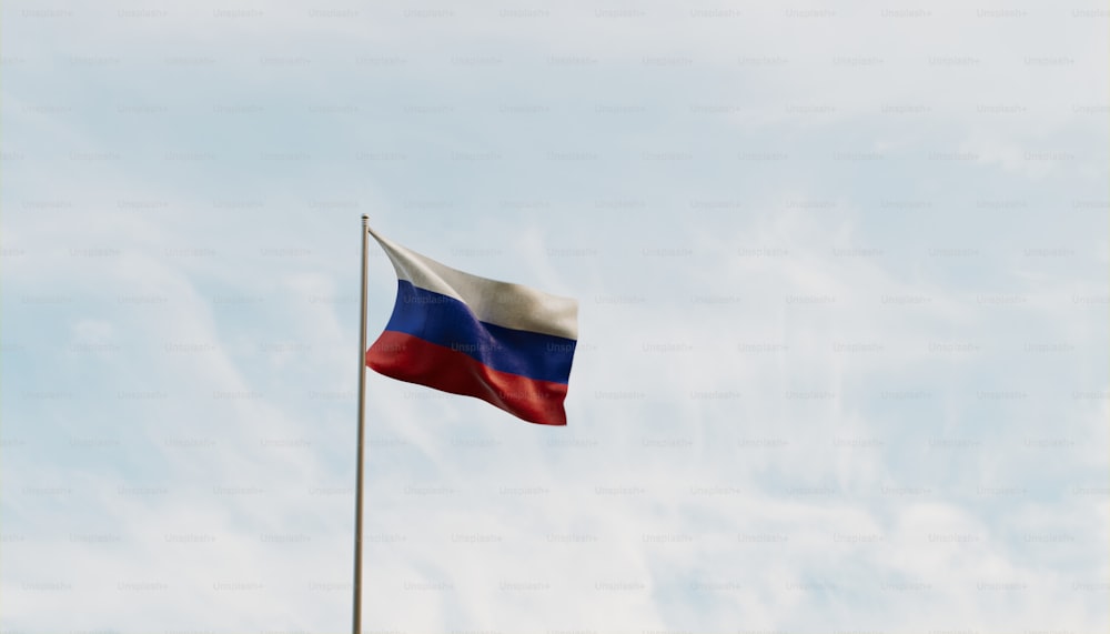 Una bandiera che sventola nel vento con un cielo blu sullo sfondo