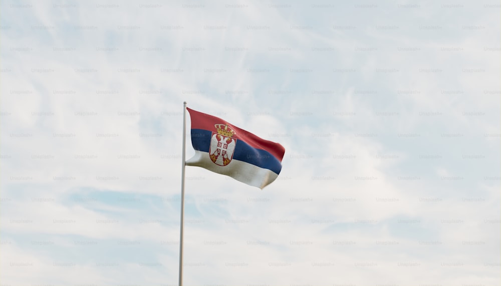 a flag flying in the wind on a cloudy day