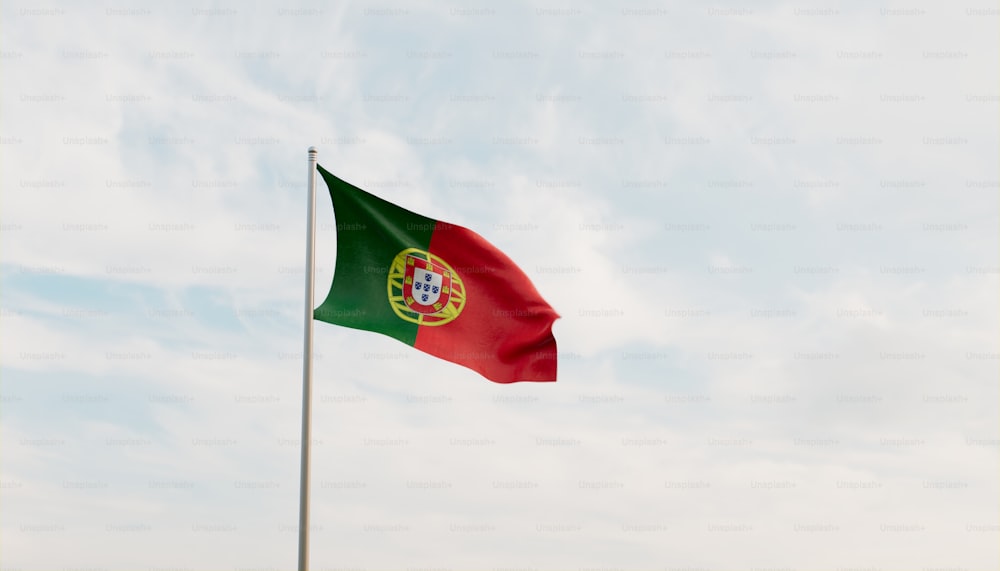 a bandeira de portugal está voando alto no céu
