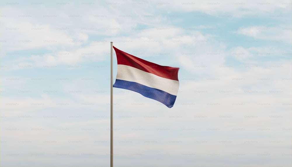 a red white and blue flag flying in the wind