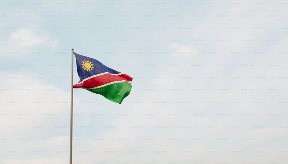 a flag flying in the wind on a sunny day