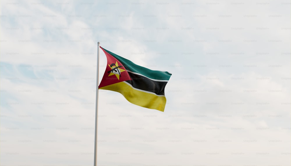 a flag flying in the wind with a sky background