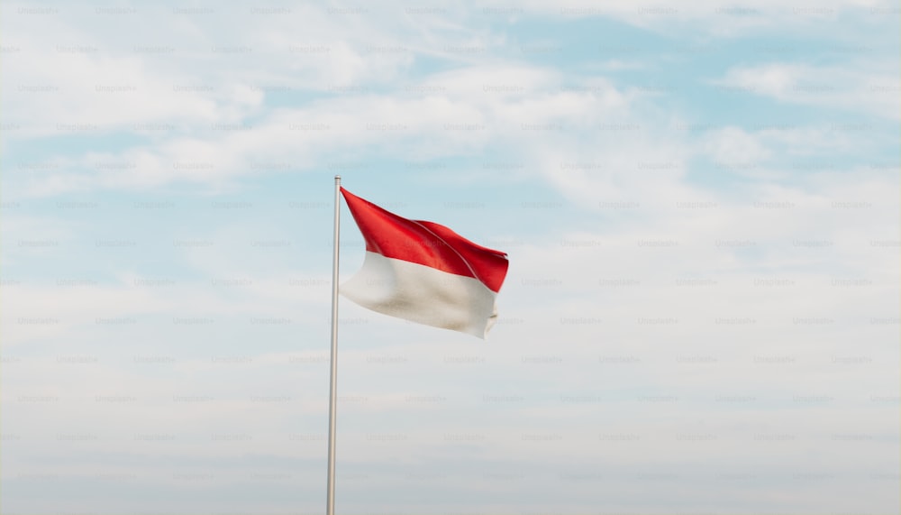 a red and white flag flying in the wind