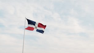 a flag flying in the wind on a cloudy day