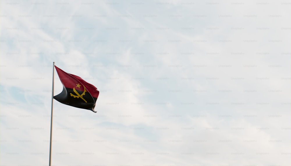 a red and black flag flying in the sky