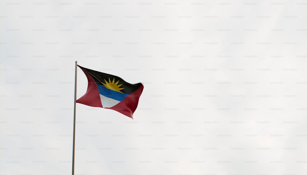 a flag flying in the wind on a cloudy day