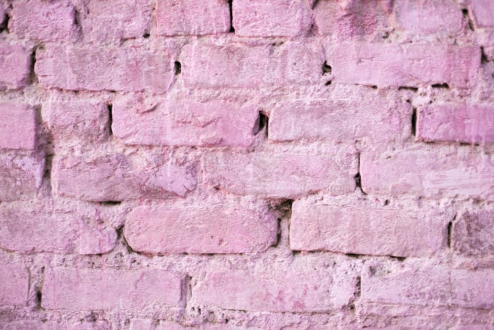 a close up of a pink brick wall