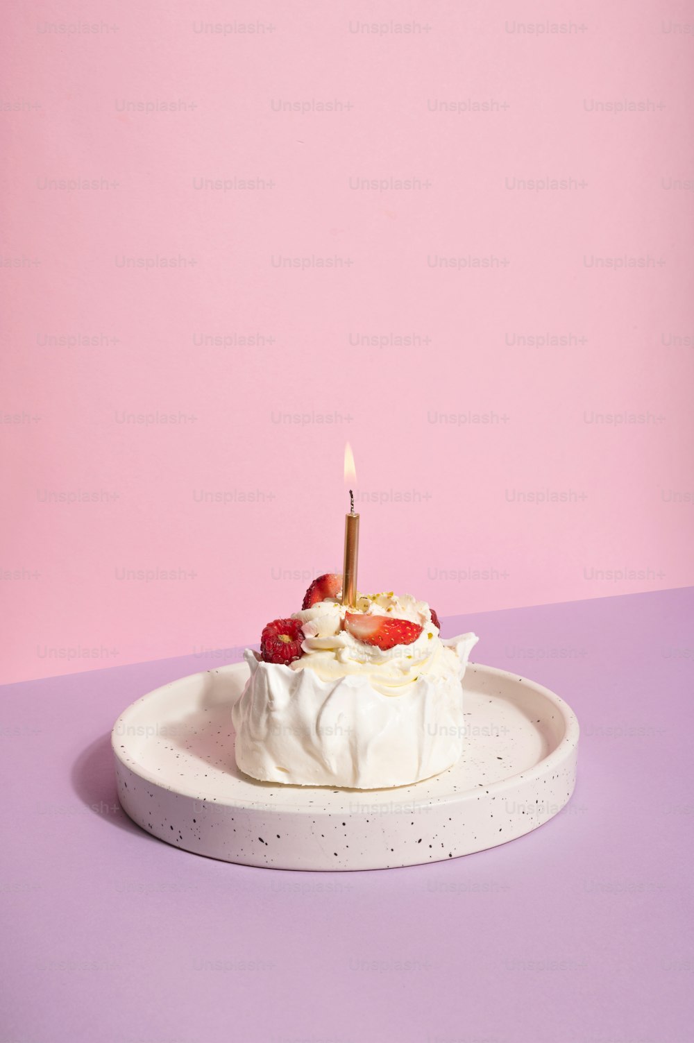 a small cake with a candle on top of it