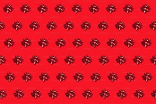 a pattern of red bows on a red background