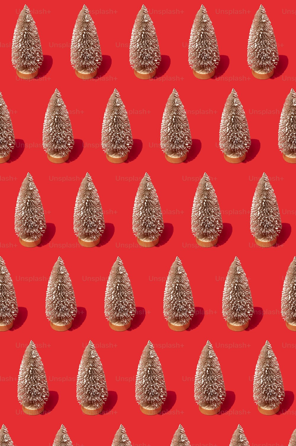 a red background with a pattern of small trees