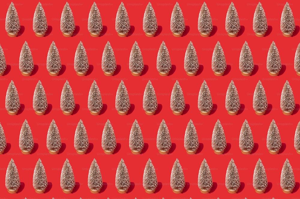 a red background with a lot of small silver objects