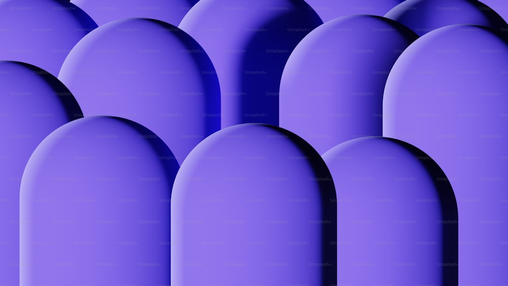 Una fila de objetos de forma ovalada púrpura sobre un fondo púrpura
