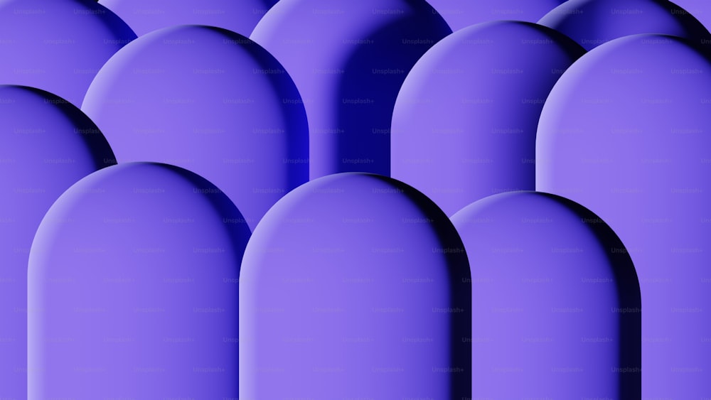 a row of purple oval shaped objects on a purple background