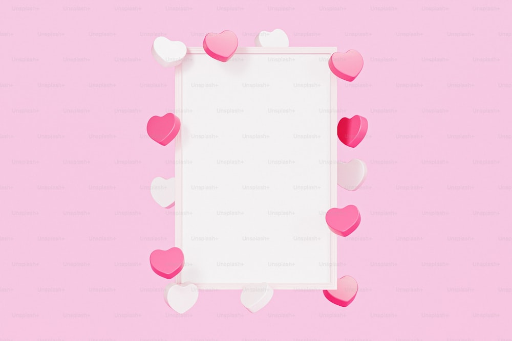 uma moldura branca com corações cor-de-rosa e brancos em um fundo rosa