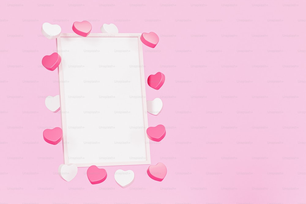 a white frame with pink and white hearts on a pink background