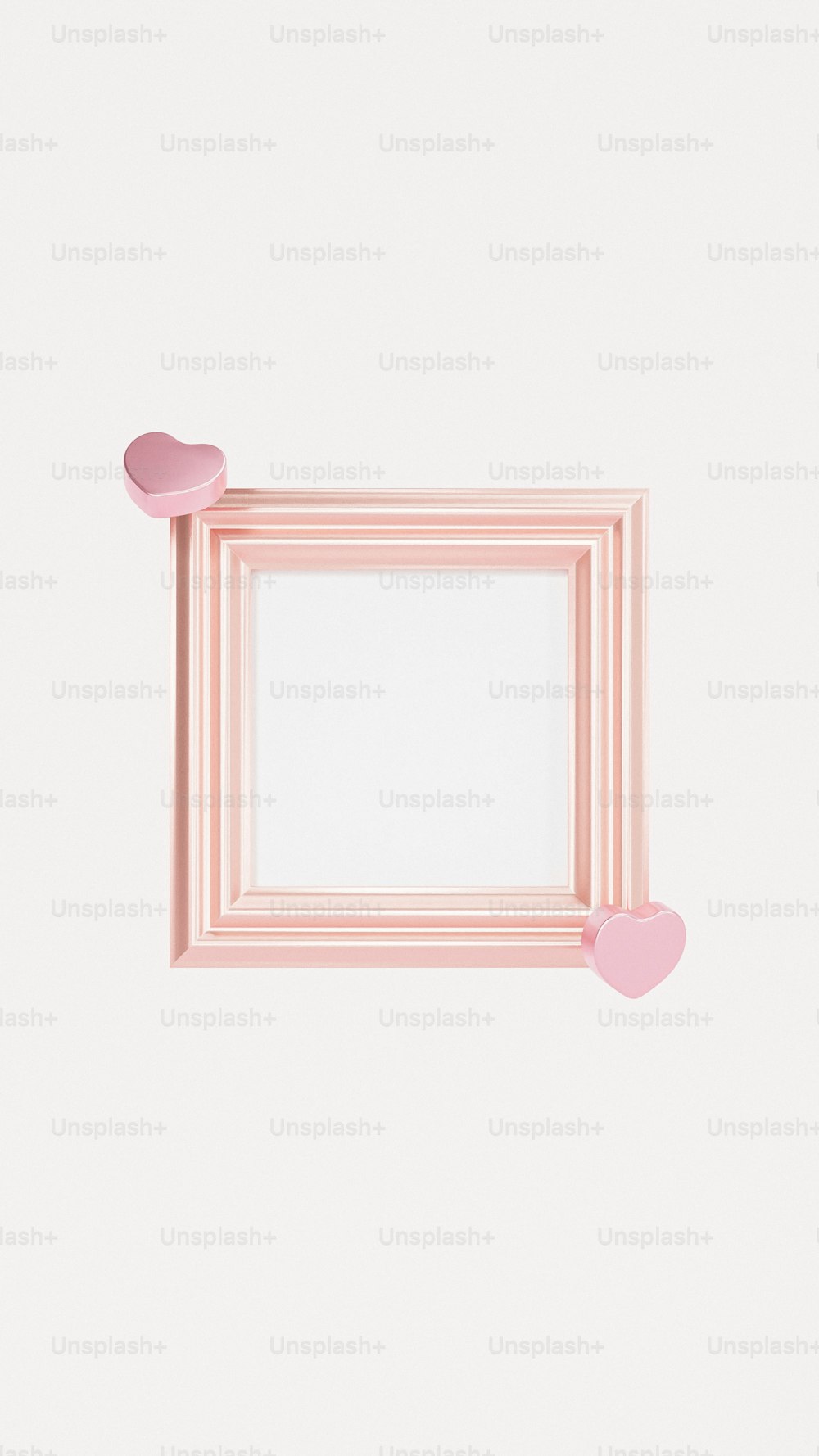 a pink picture frame with hearts hanging from it