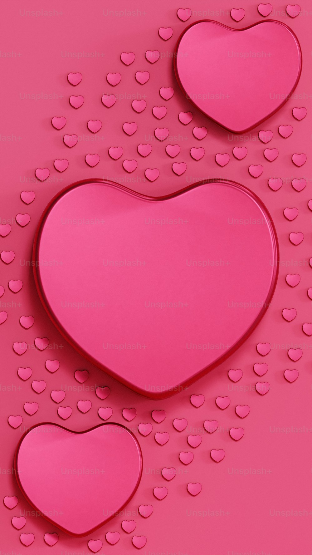 a pink heart shaped object on a pink background