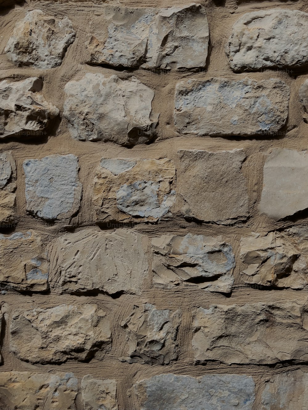 a close up of a wall made of rocks