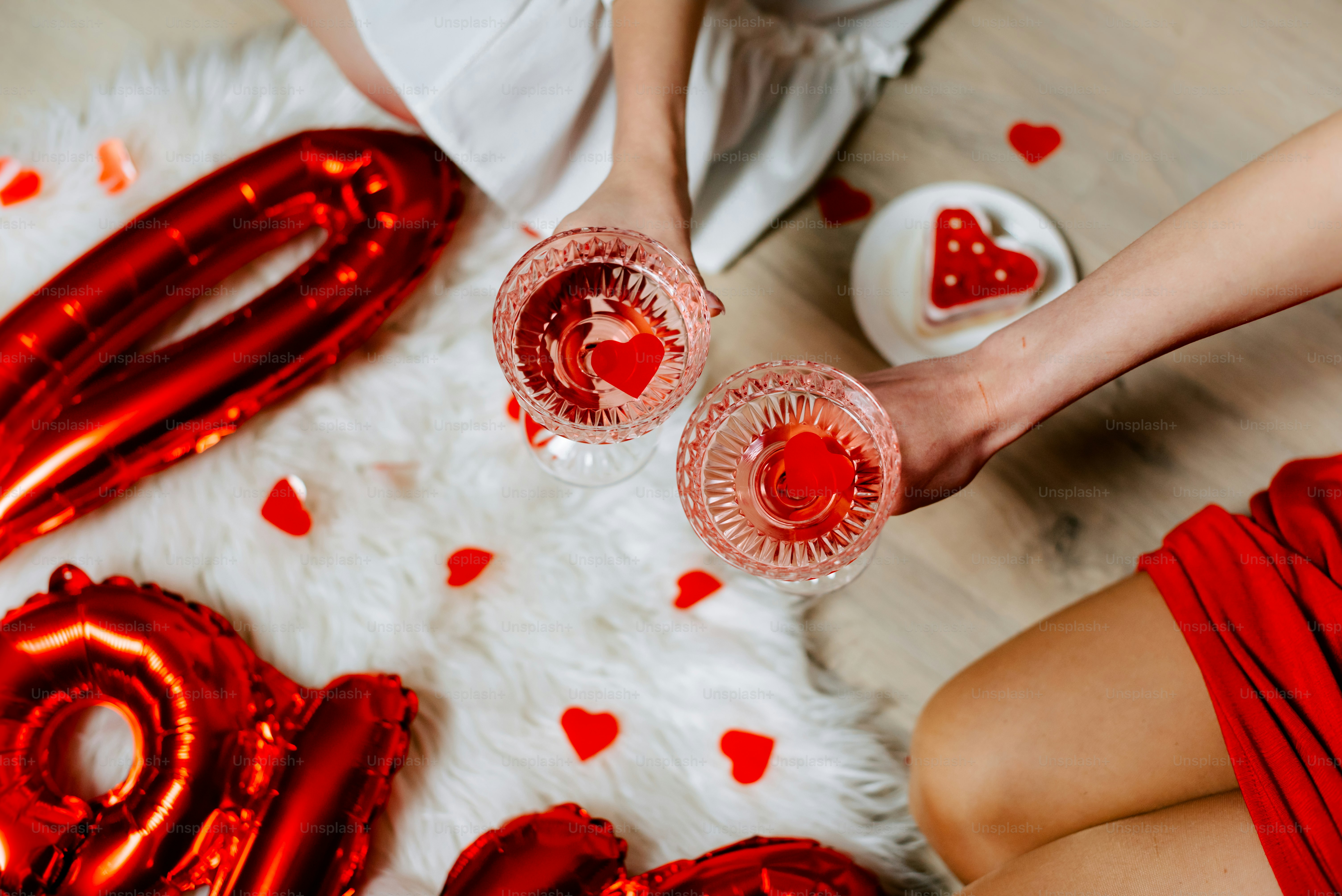 a couple of people that are holding glasses